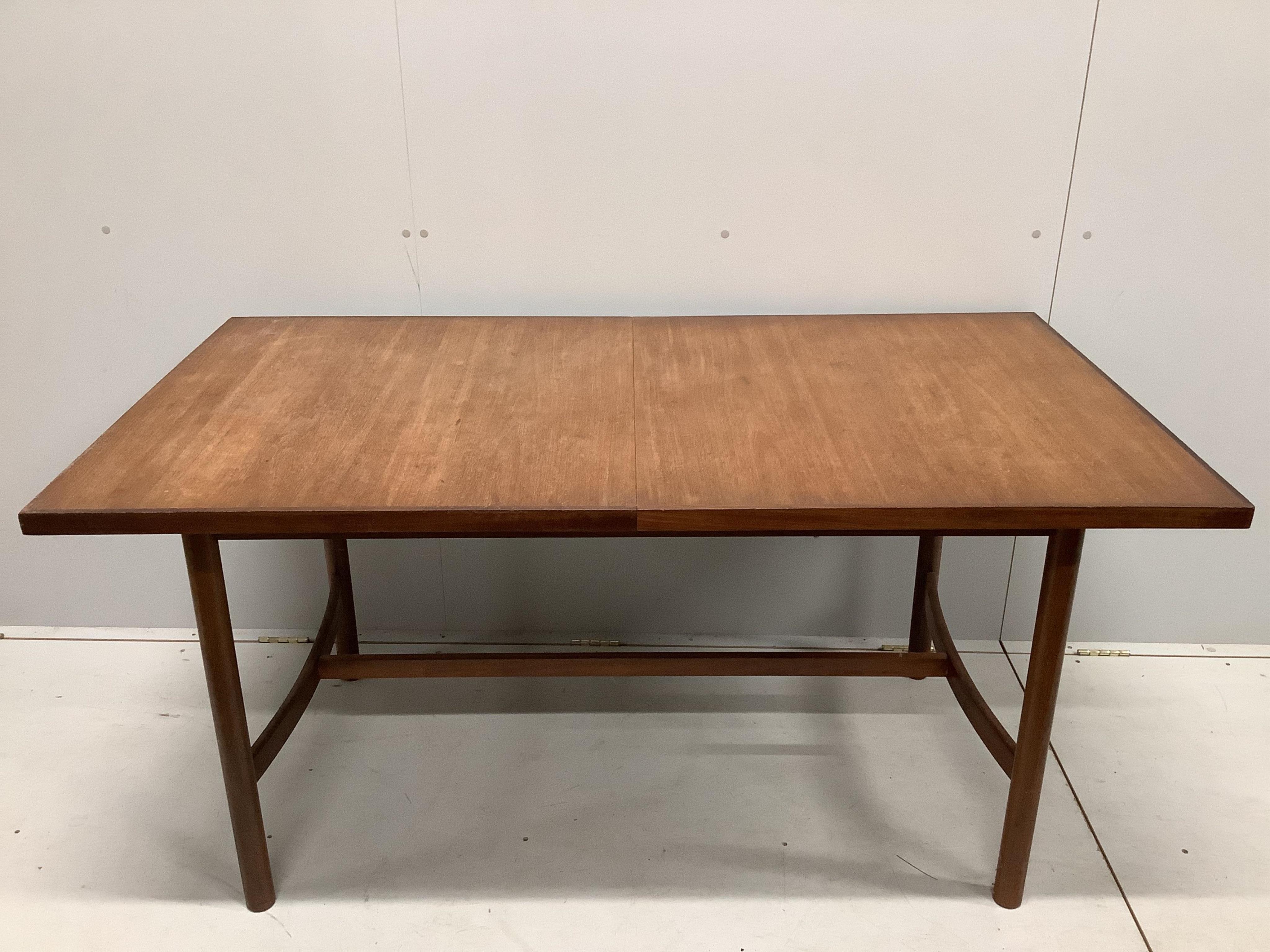 A mid century Meredew Furniture rectangular teak extending dining table and six chairs, table 206cm extended, one spare leaf, depth 84cm, height 75cm. Condition - fair.